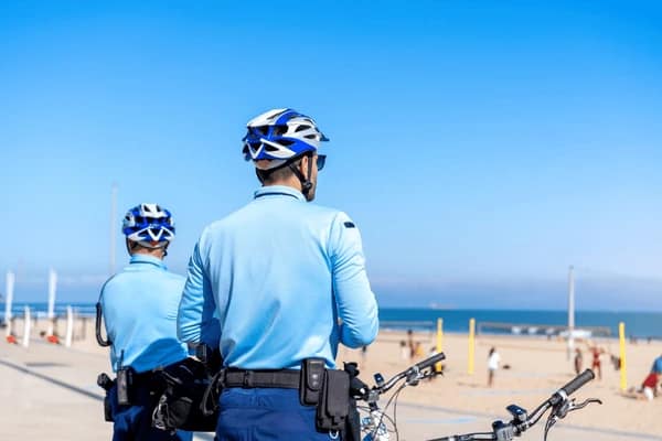two-policeman-patrolling-seaside-promenade-600nw-2159767107.webp